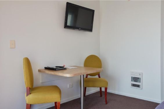 Executive One-Bedroom Suite table and TV